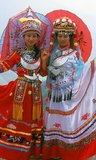 The Zhuang people (Chinese: 壮族; pinyin: Zhuàngzú; Zhuang: Bouxcuengh) are an ethnic group who mostly live in the Guangxi Zhuang Autonomous Region in southern China. Some also live in the Yunnan, Guangdong, Guizhou and Hunan provinces. They form one of the 55 minority ethnic groups officially recognized by the People's Republic of China. With the Buyi, Tay–Nùng, and other northern Tai speakers, they are sometimes known as the Rau or Rao. Their population, estimated at 18 million people, puts them second only to the Han Chinese and makes the Zhuang the largest minority in China.<br/><br/>Longji (Dragon's Backbone) Terraced Rice Fields received their name because the rice terraces resemble a dragon's scales, while the summit of the mountain range looks like the backbone of the dragon. Visitors standing on the top of the mountain can see the dragon's backbone twisting off into the distance.