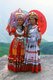 China: Zhuang women in traditional dress overlooking the Longji (Dragon's Backbone) Terraced Rice Fields, Longsheng Rice Terraces, Longsheng County, Guangxi Province